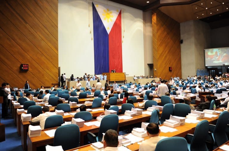 Philippine legislators vote for the Reproductive Health Bill (RH) in Manila on December 17, 2012
