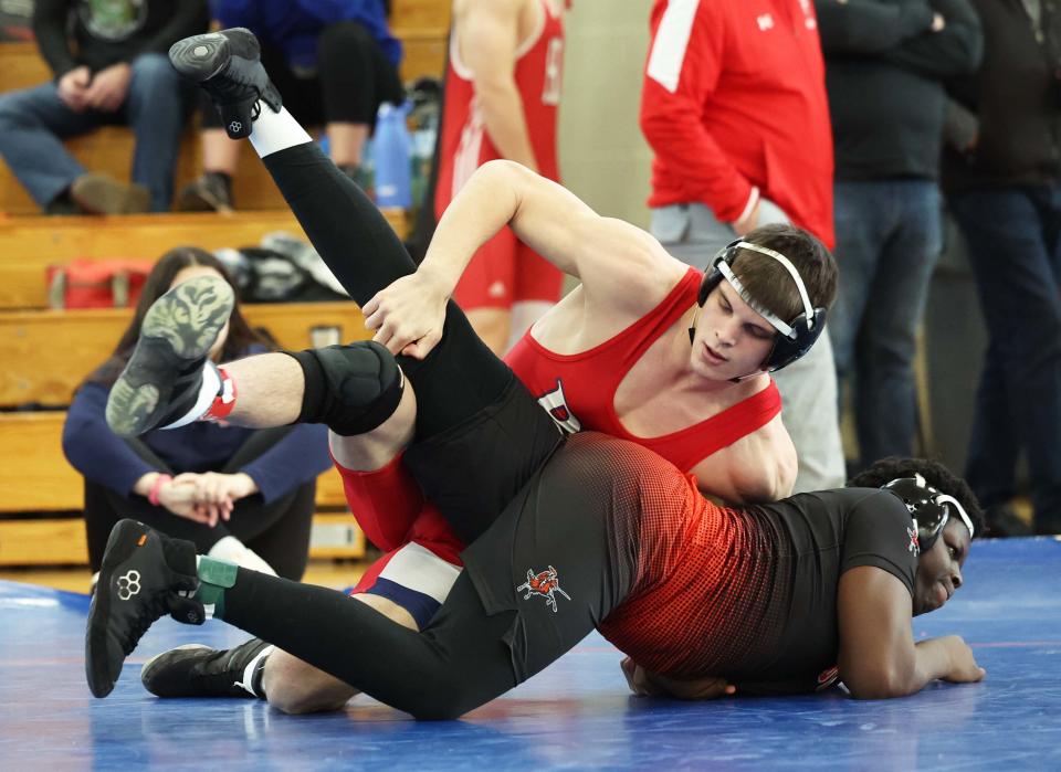 From left, Bridgewater-Raynham's Nathan Leach pinned Stoughton's Ryan Kesseh during the division two south sectional wrestling championships at Bridgewater-Raynham Regional High School on Saturday, Feb. 11, 2023.