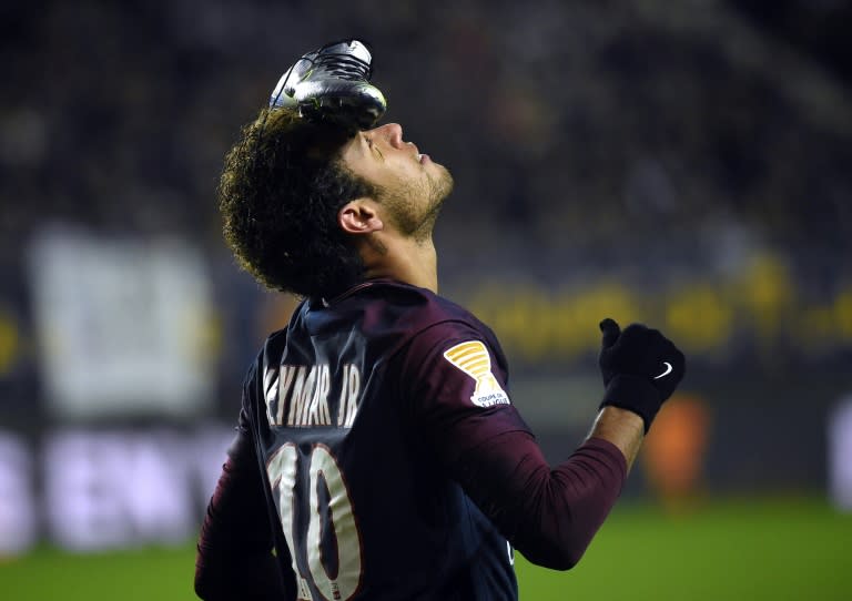 Paris Saint-Germain's Brazilian forward Neymar celebrates after scoring a penalty kick during the French League Cup quarter-final football match between Amiens (ASC) and Paris Saint-Germain (PSG) at the Licorne Stadium in Amiens, northern France