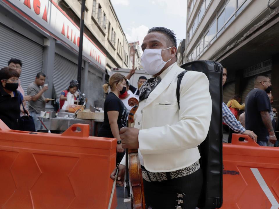 Members of the mariachi group Nuevo Acapulco, toured various streets of the Zocalo of Mexico City, Mexico, on August 17, 2020 to serenade passersby and merchants to obtain some coins in the face of the health emergency due to COVID-19 in Mexico. (Photo by Gerardo Vieyra/NurPhoto via Getty Images)