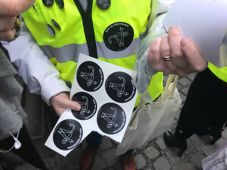 A woman holds stickers during a demonstration against changes of the country's abortion law in Oslo, Norway November 17, 2018. REUTERS/Lefteris Karagiannopoulos