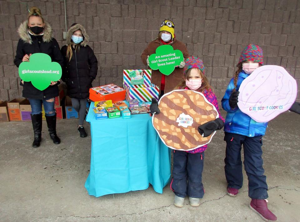 Area Girl Scouts, including, front from left, Emma Hartpence and Lily Hartpence and back, from left, Lexi Mordus, Cadance Clemens and Madyson Decock are once again selling their tasty treats.