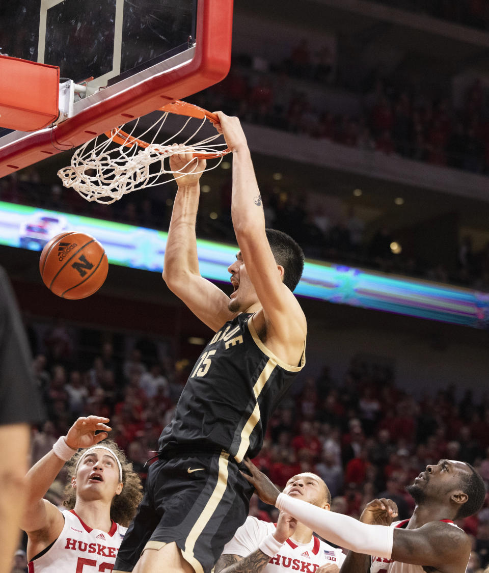 Purdue's Zach Edey dunks over Nebraska's Josiah Allick, C.J. Wilcher and Juwan Gary, from left, during the second half of an NCAA college basketball game Tuesday, Jan. 9, 2024, in Lincoln, Neb. Nebraska won 88-72. (AP Photo/Rebecca S. Gratz)