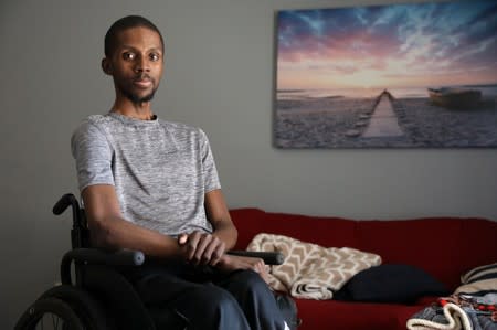 T'angelo Magee poses in his wheel chair in Hackensack, New Jersey