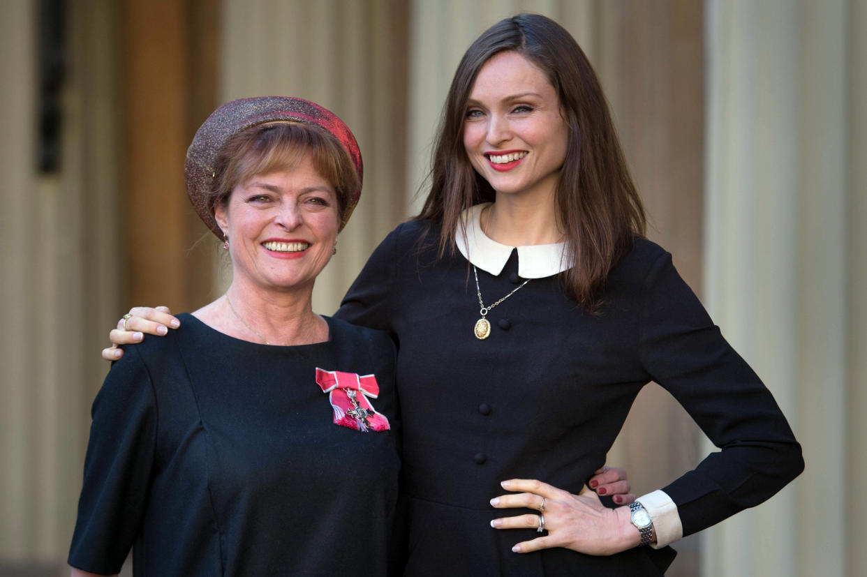 LONDON, ENGLAND - NOVEMBER 11:  Former Blue Peter presenter Janet Ellis with her daughter Sophie Ellis Bextor after receiving her MBE from the Duke of Cambridge at Buckingham Palace on November 11, 2016 in London, England. (Photo by Stefan Rousseau - WPA Pool/Getty Images)