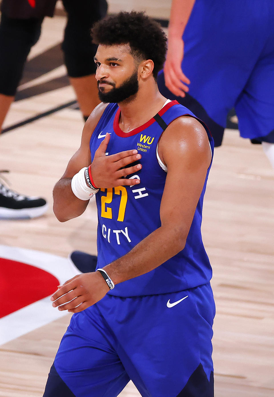 Denver Nuggets' Jamal Murray reacts after scoring to put his team in the lead during the fourth quarter of an NBA basketball game against the Utah Jazz, Saturday, Aug. 8, 2020, in Lake Buena Vista, Fla. (Kevin C. Cox/Pool Photo via AP)