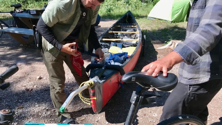 From pedal to paddle: 2 men hauling canoe 1,200 km by bike to Mackenzie River