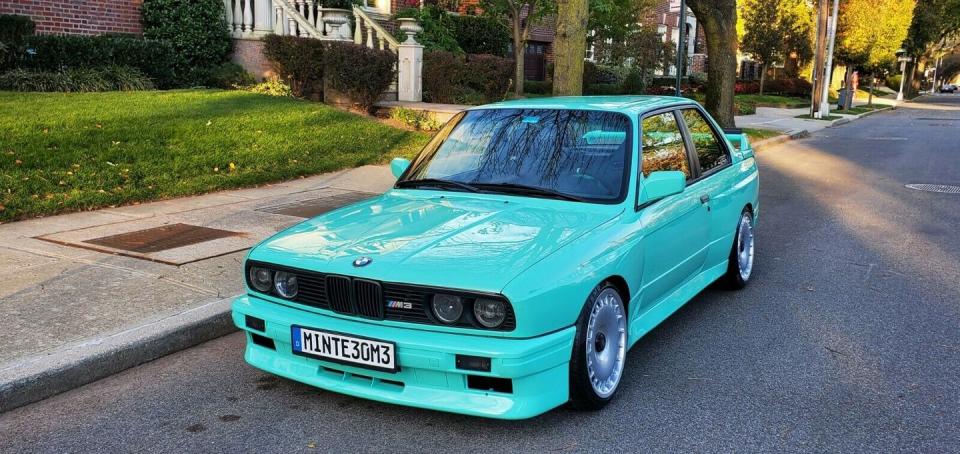 <p>This E30-generation 3-Series has been heavily customized with OEM M3 body panels and a lovely mint green paint job. It also has coilovers, a roll cage, and a set of sweet diamond-stitched custom seats. <a href="https://www.ebay.com/itm/1987-BMW-3-Series-m3/293378709375?hash=item444ebbd77f:g:HFYAAOSwbv9d2sdt&autorefresh=true" rel="nofollow noopener" target="_blank" data-ylk="slk:It's for sale right now on eBay;elm:context_link;itc:0;sec:content-canvas" class="link ">It's for sale right now on eBay</a> for $27,000. </p>