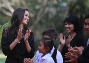 <p>Actress Angelina Jolie (L) and Cambodian-born American human rights activist and lecturer Loung Ung laugh as they arrive for a news conference at a hotel in Siem Reap province, Cambodia, Feb. 18, 2017. (Photo: Samrang Pring/Reuters) </p>