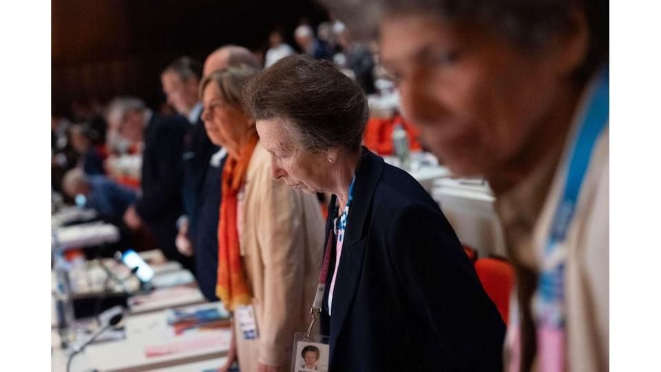 Princess Anne observes a moment of silence to remember Olympic officials who died in the past year during the start of the 142nd IOC session