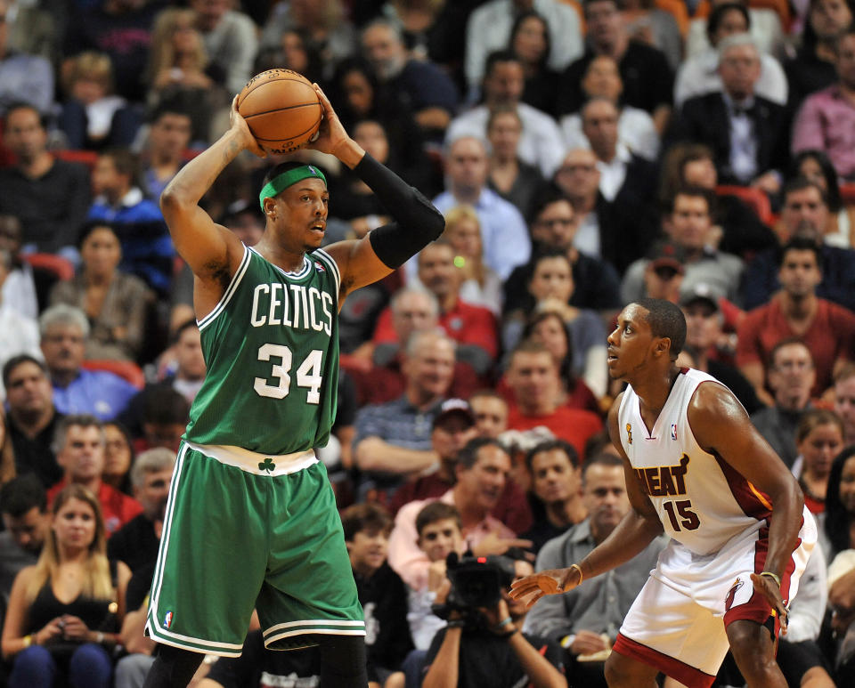 Oct 30, 2012; Miami, FL, USA;  Boston Celtics small forward Paul Pierce (34) is pressured by Miami Heat point guard Mario Chalmers (15) during the second half at American Airlines Arena. Mandatory Credit: Steve Mitchell-USA TODAY Sports
