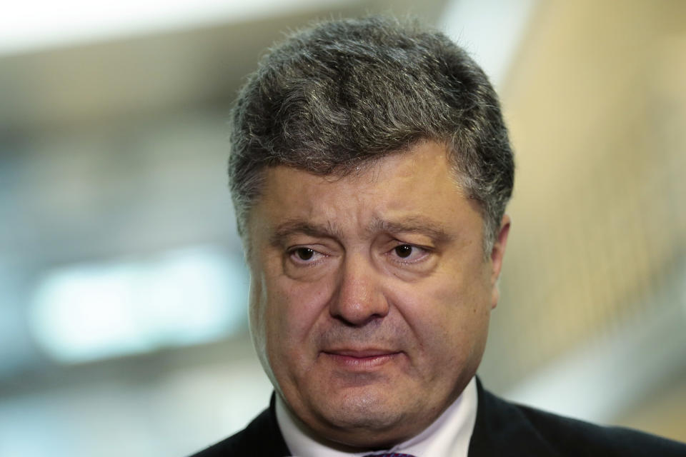 Ukrainian presidential candidate and businessman Petro Poroshenko briefs the media after a meeting with Germany's Christian Union's faction law makers in Berlin, Germany, Wednesday, May 7, 2014. The Ukrainian government is planing a presidential election on May 25, 2014. (AP Photo/Markus Schreiber)