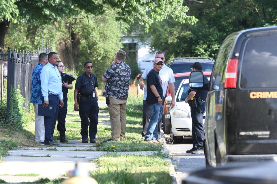 Detroit police respond to the scene where three dogs attacked a young girl who later died of her injuries in Detroit on Monday, Aug. 19, 2019. Police say the owner of three dogs is in custody after the animals killed Emma Hernandez, 9, as she rode a bike. The girl's father, Armando Hernandez, says the man was warned that a fence was too flimsy to hold the dogs. (Max Ortiz/Detroit News via AP)