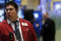 Traders work on the floor of the New York Stock Exchange February 3, 2014. REUTERS/Brendan McDermid