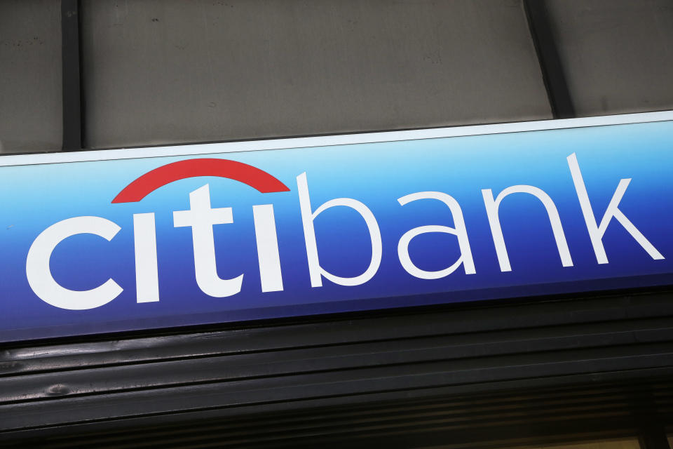 FILE - In this Jan. 15, 2015, file photo, a Citibank sign hangs above a branch office in New York. The tens of millions of consumers and businesses out of work from the coronavirus pandemic weighed heavily on the financial results of Wall Street’s biggest banks on Tuesday, July 14, 2020, with the likes of JPMorgan Chase, Wells Fargo and Citigroup setting aside tens of billions of dollars to cover potentially bad loans that were just fine only a few months ago. (AP Photo/Mark Lennihan, File)