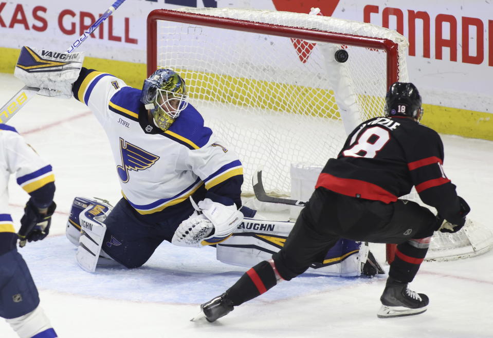 Ottawa Senators Tim Stutzle (18) scores against St. Louis Blues goaltender Thomas Greiss (1) during second-period NHL hockey game action in Ottawa, Ontario, Sunday, Feb. 19, 2023. (Patrick Doyle/The Canadian Press via AP)