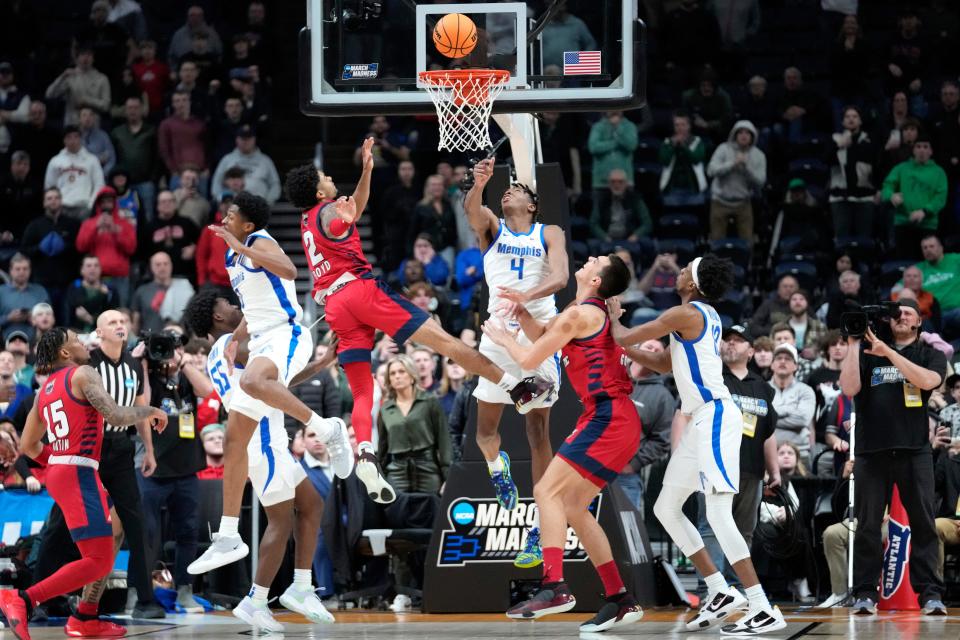 Florida Atlantic guard Nicholas Boyd (2) hits the game winning basket against the Memphis Tigers in the second half of a first-round college basketball game in the NCAA Tournament Friday, March 17, 2023, in Columbus, Ohio. Florida Atlantic won 66-65. (AP Photo/Paul Sancya)