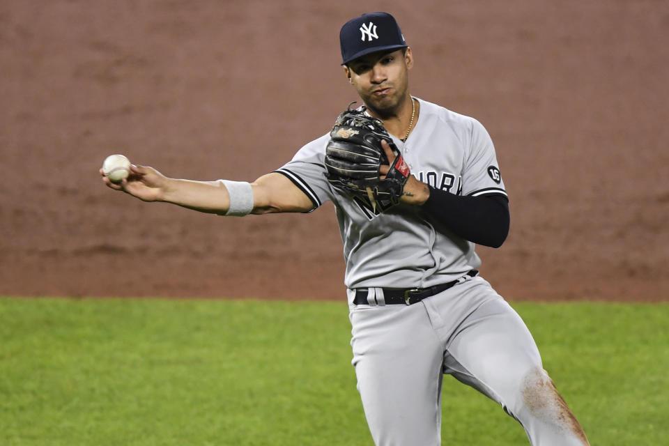 New York Yankees shortstop Gleyber Torres (25) records put out during the eighth inning of a baseball game against the Baltimore Orioles on Monday, April 26, 2021, in Baltimore, Md. (AP Photo/Terrance Williams)