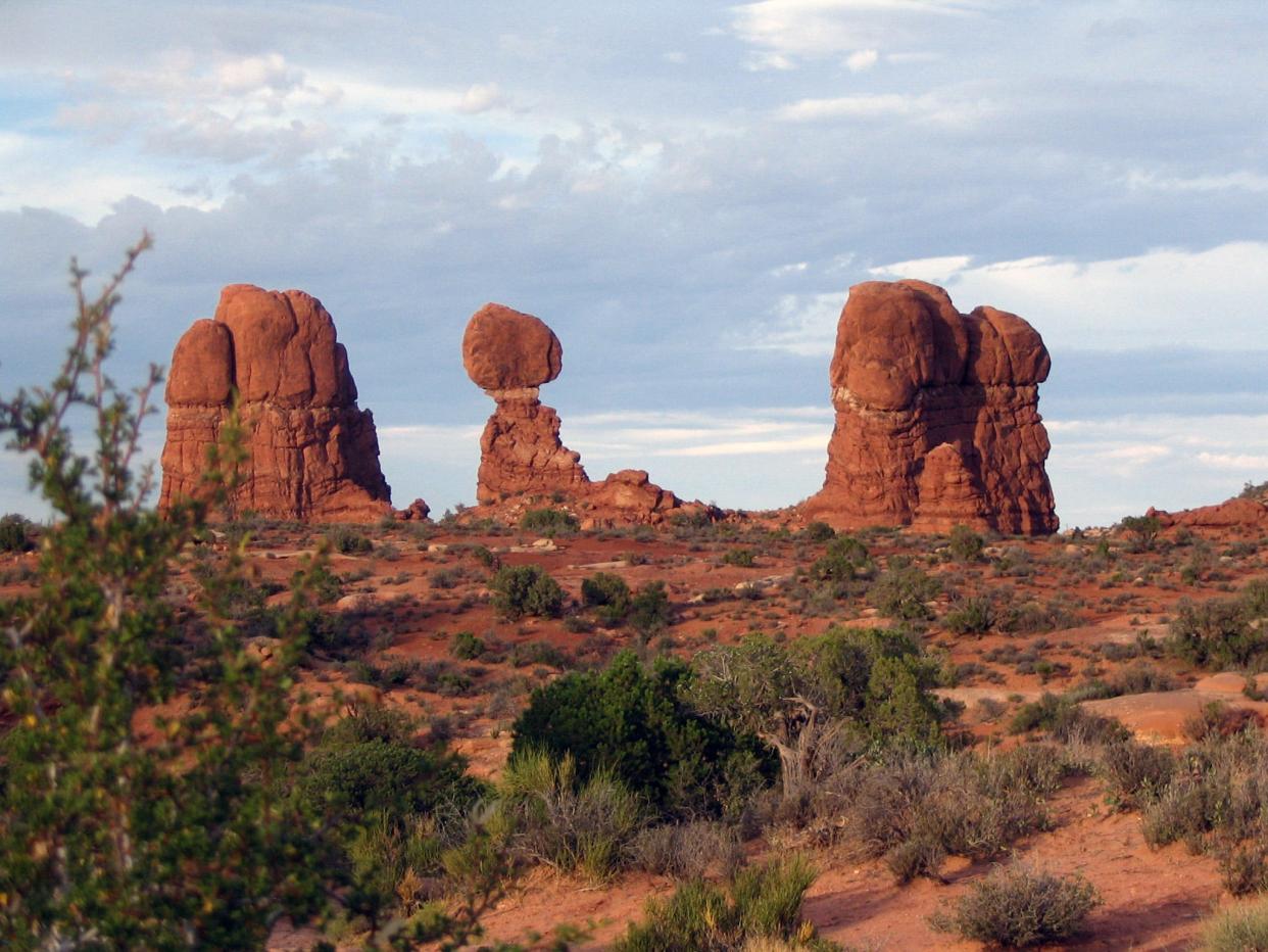 Balanced Rock stands 128 feet tall and can be seen from the road at Arches National Park.