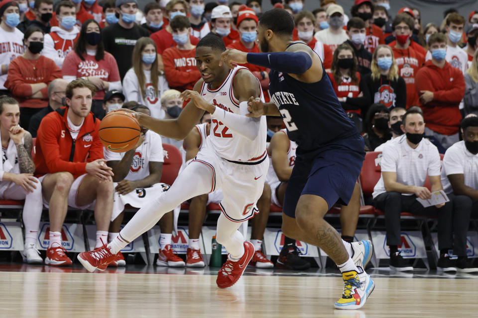 Ohio State's Malaki Branham, left, drives to the basket against Penn State's Myles Dread during the second half of an NCAA college basketball game Sunday, Jan. 16, 2022, in Columbus, Ohio. (AP Photo/Jay LaPrete)