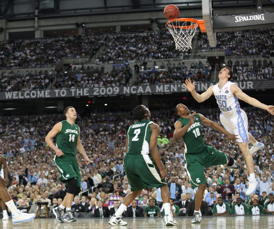 Michigan State's  Goran Suton, Raymar Morgan and Delvon Roe watch with North Carolina's Tyler Hansbrough's shot hangs on the rim during 1st half action at the  NCAA Men's Final Four at Ford Field in Detroit, MI. Monday, April 6, 2009.