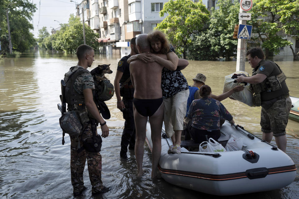 Residents are evacuated from a flooded neighborhood in Kherson, Ukraine, Wednesday, June 7, 2023 after the walls of the Kakhovka dam collapsed. Residents of southern Ukraine braced for a second day of swelling floodwaters on Wednesday as authorities warned that a Dnieper River dam breach would continue to unleash pent-up waters from a giant reservoir. (AP Photo/Roman Hrytsyna)