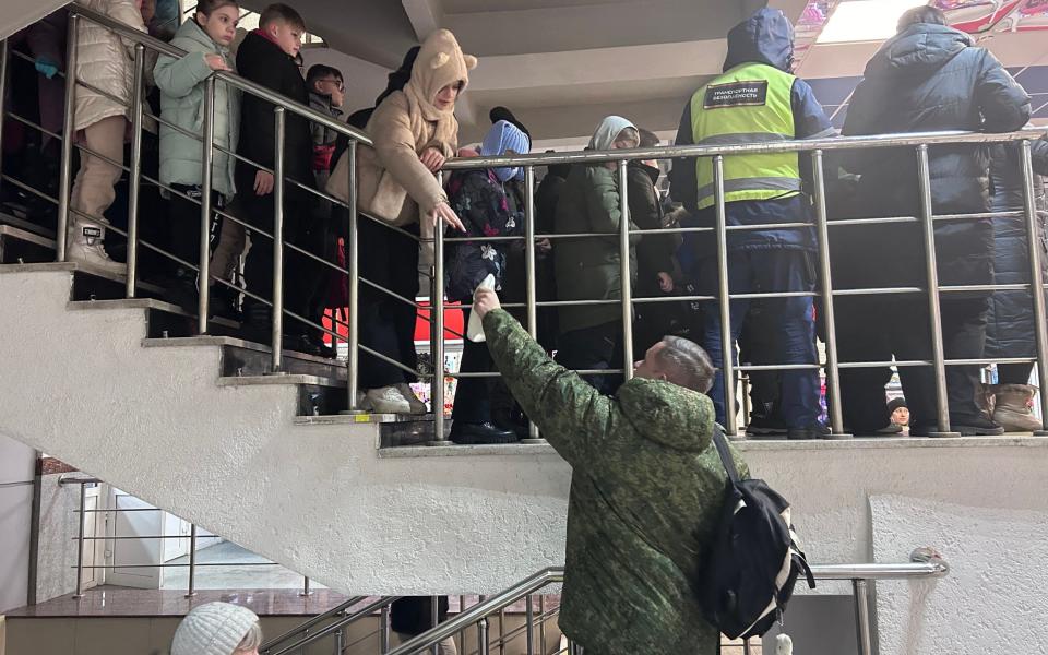 Children gather at Belgorod's railway station as they are evacuated to the Kaluga region