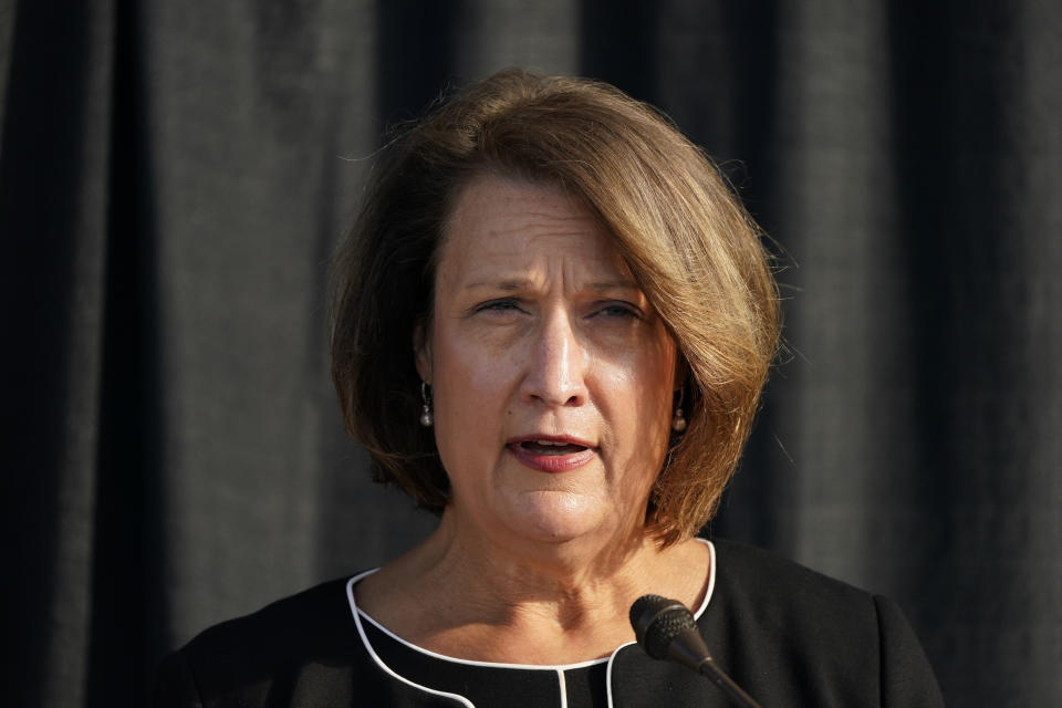 University of Utah President Ruth Watkins speaks during a news conference Thursday, Oct. 22, 2020, in Salt Lake City. The parents of a University of Utah track athlete who was killed by her ex-boyfriend on campus two years ago reached a $13.5 million settlement Thursday with the university, which acknowledged that it didn't handle the woman's case properly. (AP Photo/Rick Bowmer)