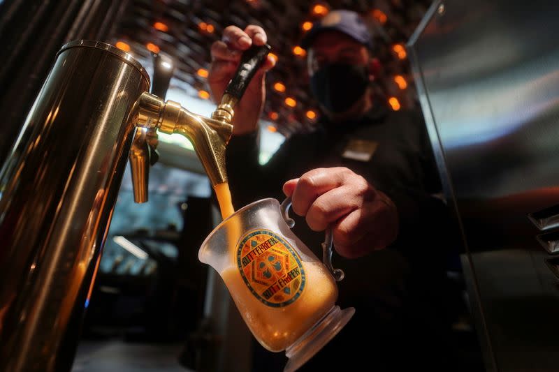 Thierry Sighel draws a mug of draft Butterbeer in New York City