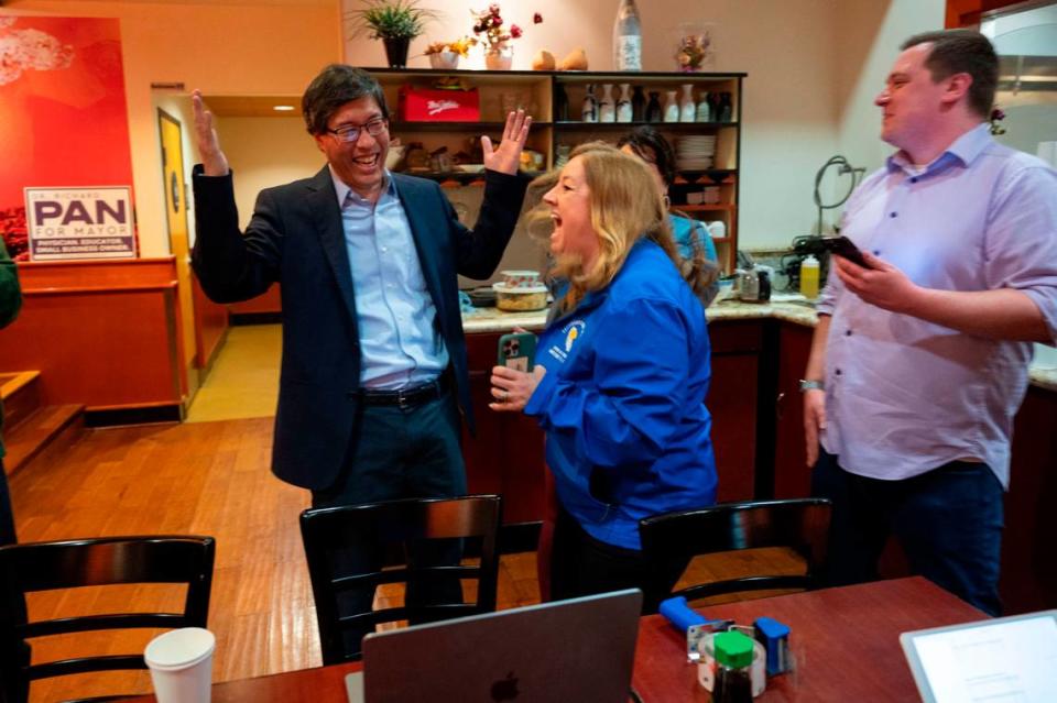 Mayoral candidate Richard Pan, left, celebrates with state Sen. Angelique Ashby and campaign manager Brandon Black after seeing initial results in the primary election March 5, 2024, at his election night party at Sushi Elite in North Natomas.