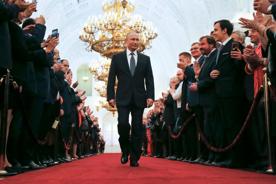 Vladimir Putin enters his inauguration ceremony as Russia's president in 2018, where he took the oath for his fourth term.