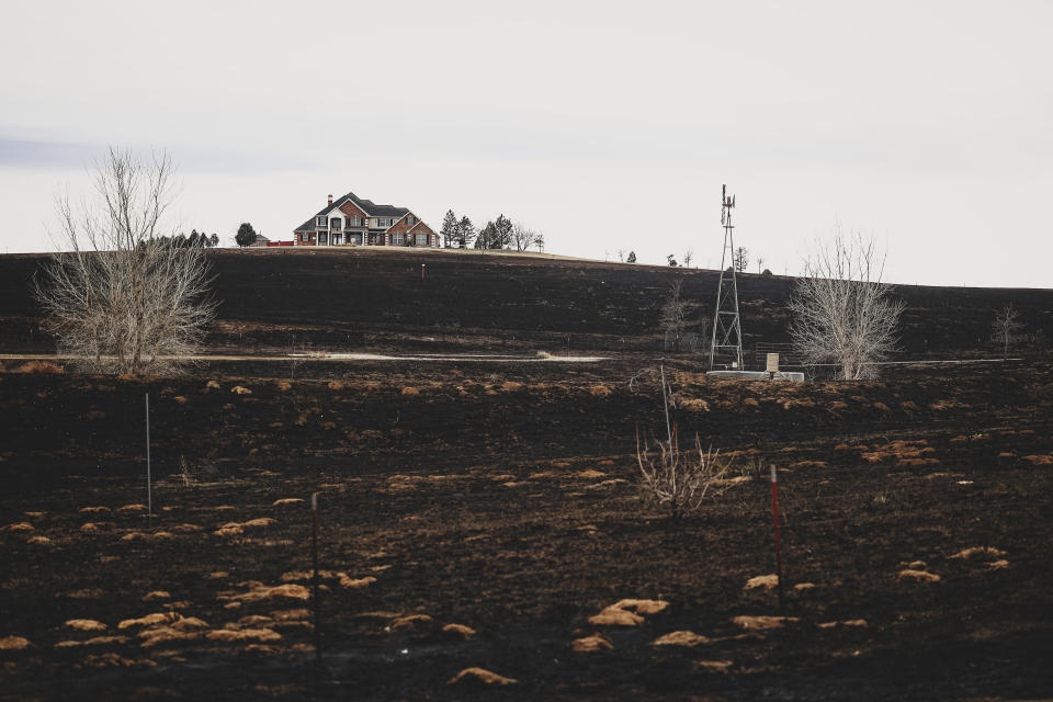 A residence on the outskirts of town survives after the Smokehouse Creek Fire, Thursday, Feb. 29, 2024, in Canadian, Texas. (AP Photo/David Erickson)