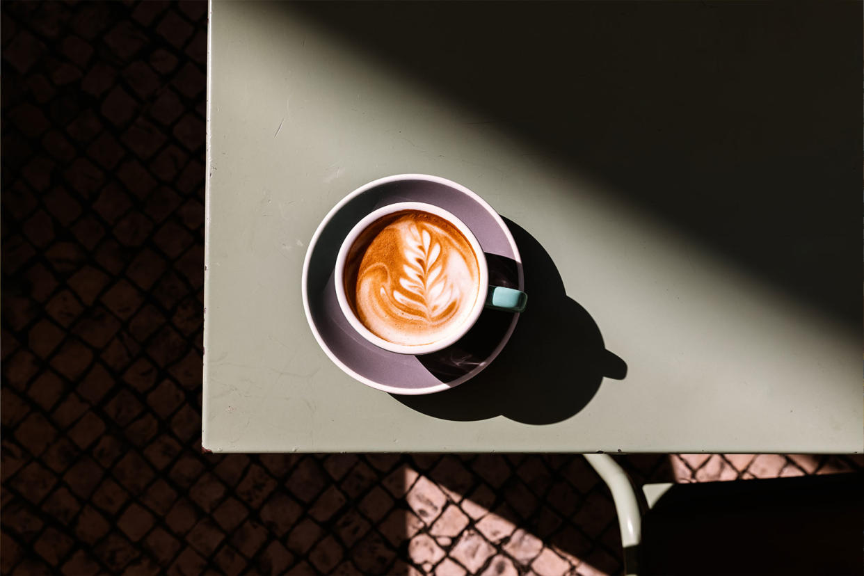 Cappuccino with latte art on the table Getty Images/Alexander Spatari