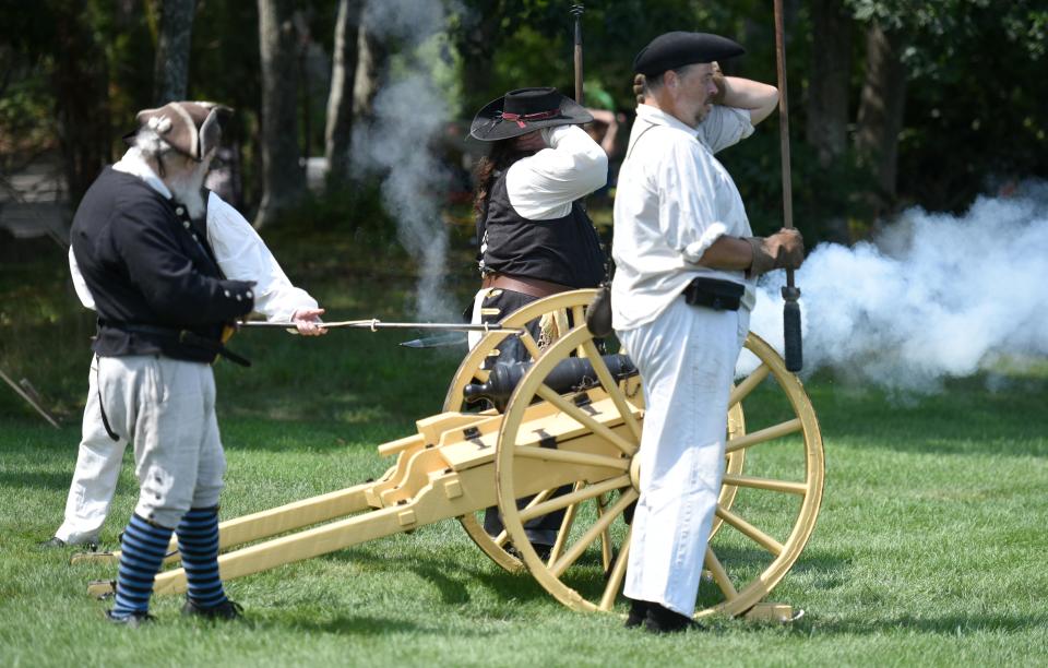 The Yarmouth Minutemen put on live fire cannon display on the first day of the Pirate Festival.