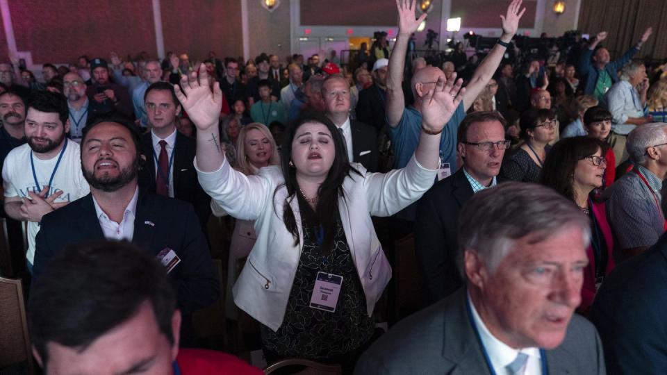 People pray during the Pray Vote Stand Summit, Friday, Sept. 15, 2023, in Washington. (AP Photo/Jose Luis Magana)