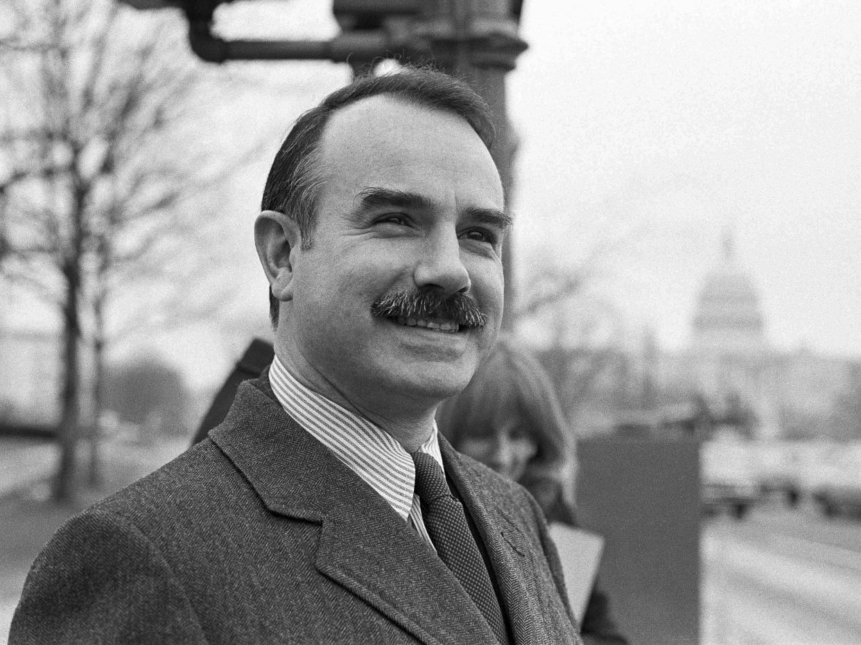 FILE - In this Jan. 16, 1973, file photo, Watergate figure G. Gordon Liddy is seen in Washington during a break in his trial. Liddy, a mastermind of the Watergate burglary and a radio talk show host after emerging from prison, has died at age 90. His son, Thomas Liddy, confirmed the death Tuesday, March 30, 2021, but did not reveal the cause. (AP Photo/William A. Smith, File)