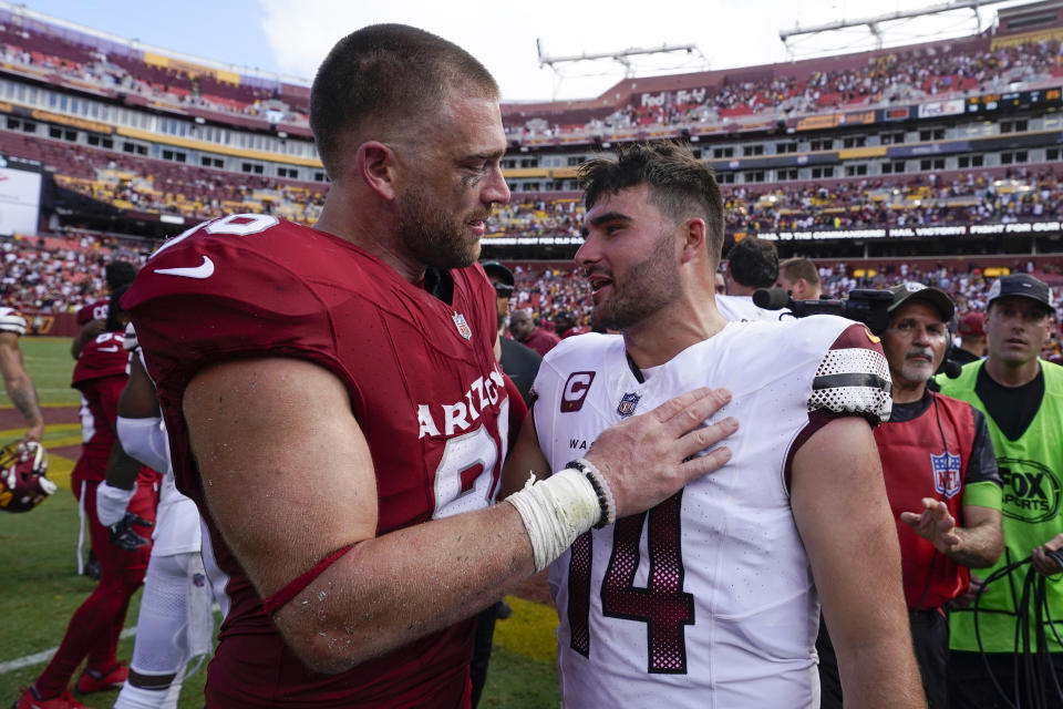 Arizona Cardinals tight end Zach Ertz (86) and Washington Commanders quarterback Sam Howell (14) meet on the field after an NFL football game, Sunday, Sept. 10, 2023, in Landover, Md. Washington won 20-16. (AP Photo/Alex Brandon)