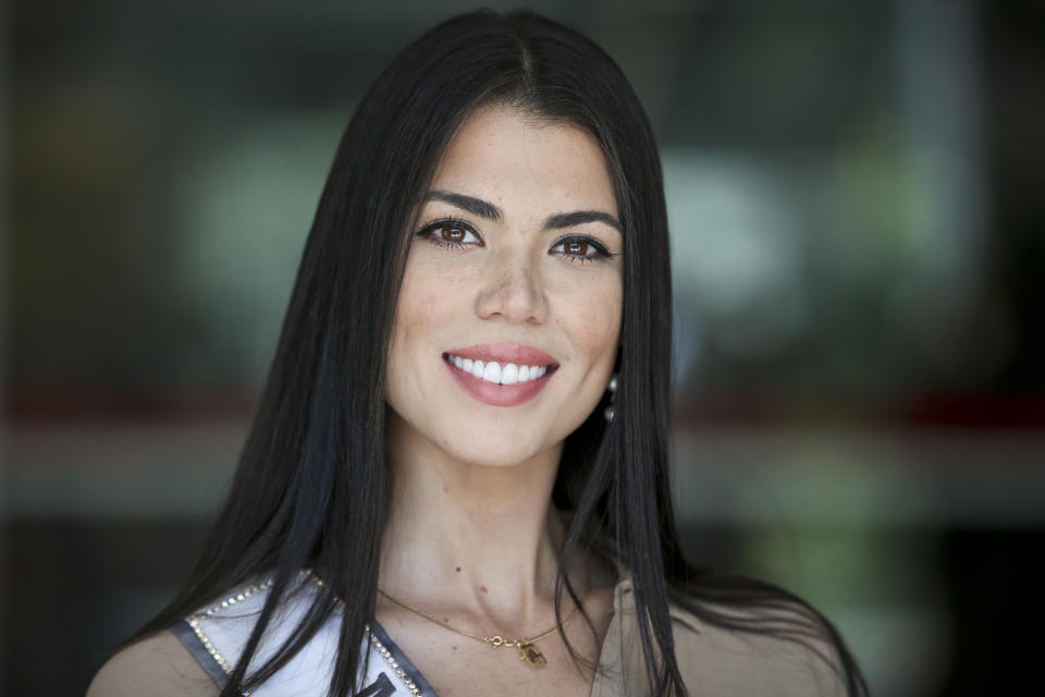 In this Nov. 8, 2018 photo, Venezuelan born Andrea Diaz, Miss Chile, poses for a picture after a runway class in Santiago, Chile. Diaz was born and raised in Valencia, Venezuela, where from the age of 12 she was learning to sway her hips and glide gracefully down catwalks at a local modeling academy, but now she will be representing Chile in the Miss Universe pageant. (AP Photo/Esteban Felix)