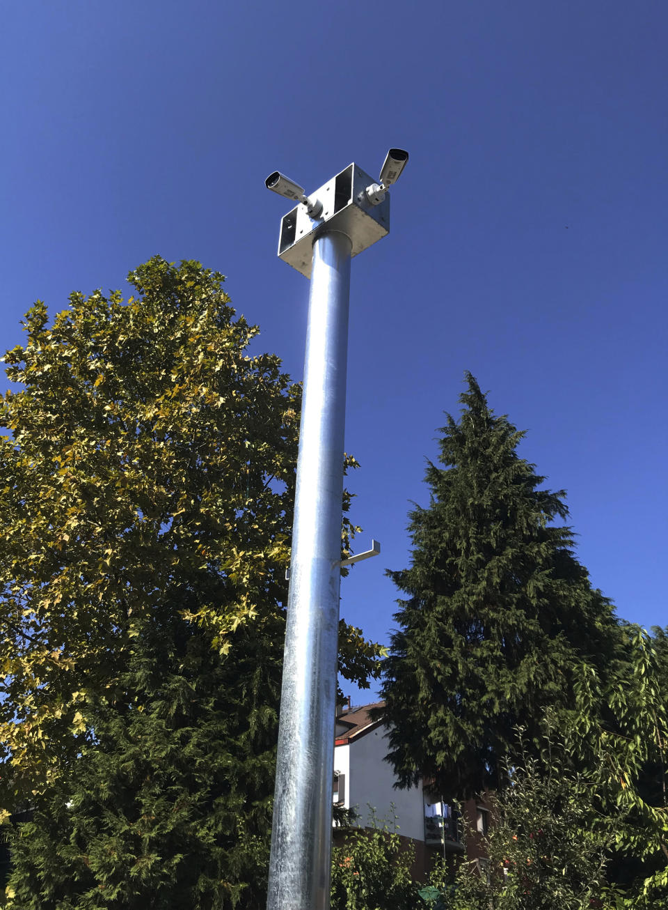 In this Oct 2, 2019, photo, cameras hang from a pole in Belgrade, Serbia. A video surveillance system with facial recognition by Chinese tech giant Huawei is being rolled out across hundreds of cities worldwide, particularly in poor countries with weak track records on human rights where Beijing has increased its influence through big business deals. (AP Photo/Dusan Stojanovic)