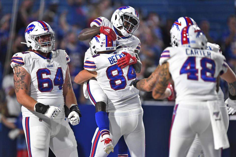 Buffalo Bills' Christian Wade, top, celebrates his touchdown with teammates during the second half of an NFL preseason football game against the Indianapolis Colts, Thursday, Aug. 8, 2019, in Orchard Park, N.Y. (AP Photo/Adrian Kraus)