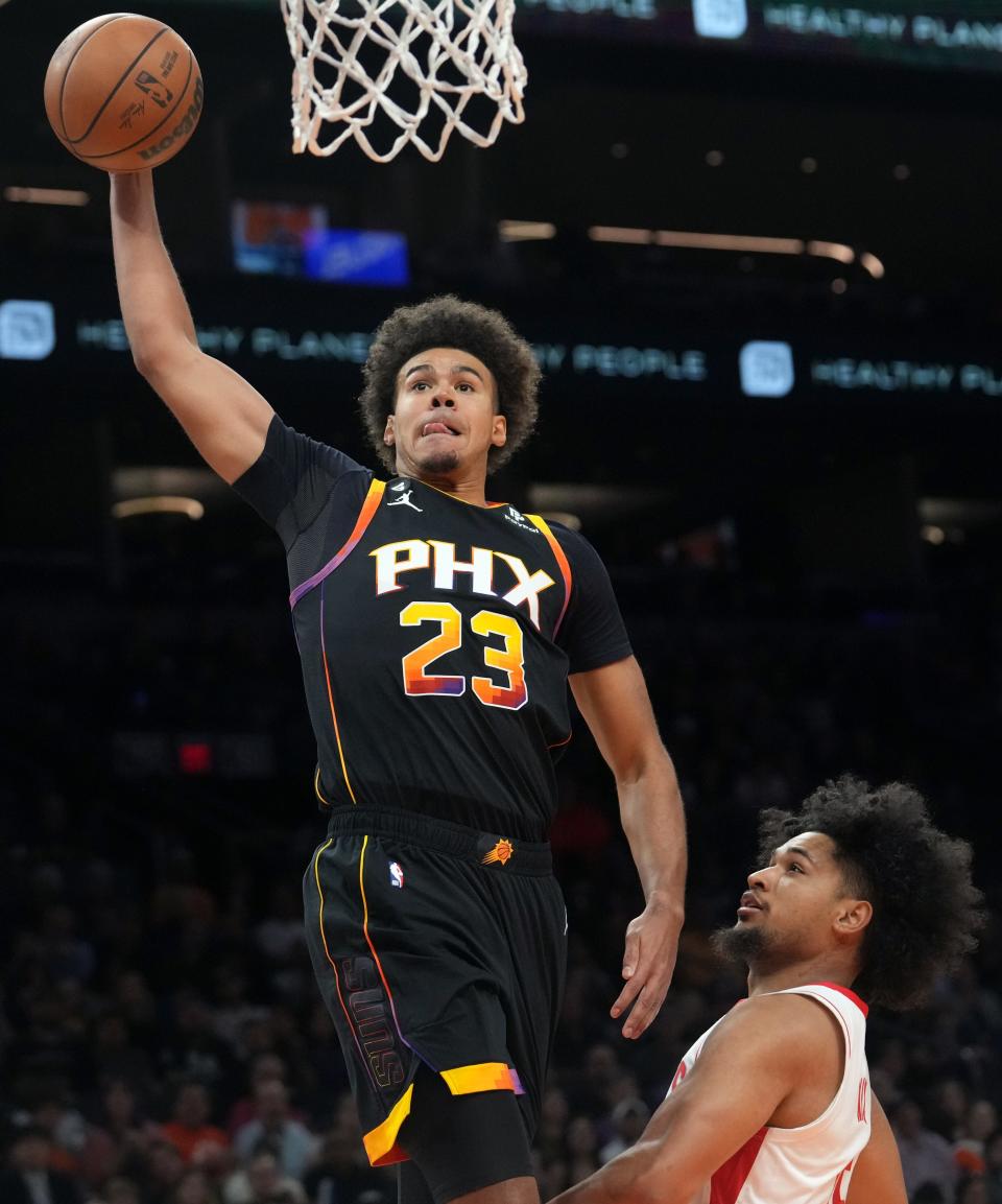 Oct 30, 2022; Phoenix, AZ, USA; Phoenix Suns forward 	Cameron Johnson (23) dunks the ball over Houston Rockets guard Daishen Nix (15) at Footprint Center. Mandatory Credit: Joe Rondone-Arizona Republic
