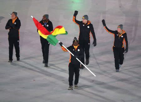 Feb 9, 2018; Pyeongchang, South Korea; Akwasi Frimpong, the flag bearer for Ghana, walks with his fellow athletes during the opening ceremony of the Pyeongchang 2018 Olympic Winter Games at Pyeongchang Olympic Stadium. Mandatory Credit: Matt Kryger-USA TODAY Sports