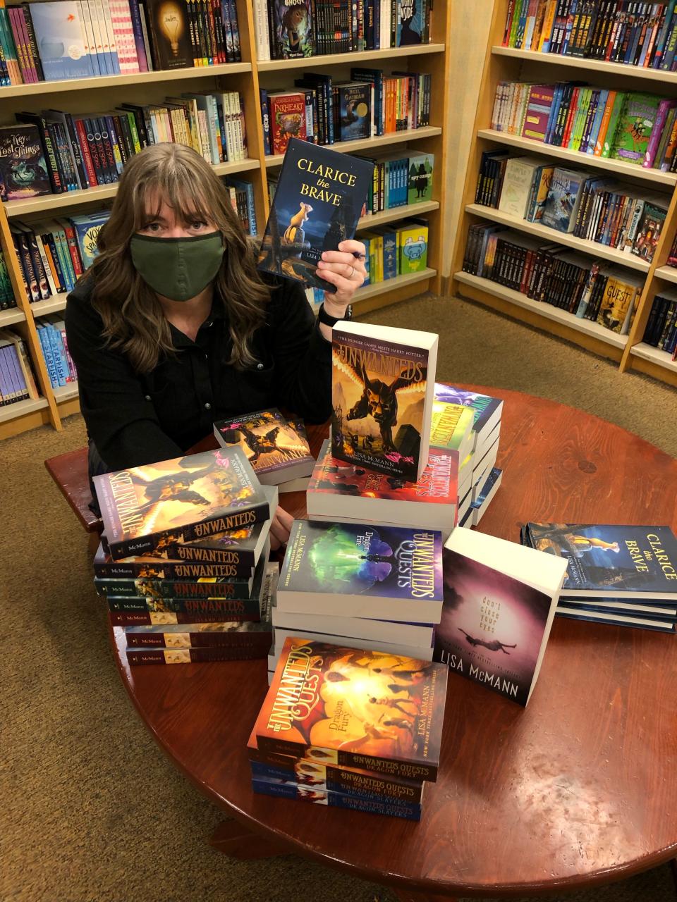 Lisa McMann poses for a photo during a book signing. McMann has visited thousands of students virtually during the COVID-19 pandemic.