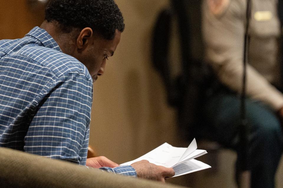 Justin Johnson, one of the men accused of killing rapper Young Dolph, reads the judge's charge to the jury during the final day of his trial in Shelby County Criminal Court, Tuesday, Sept. 24, 2024.