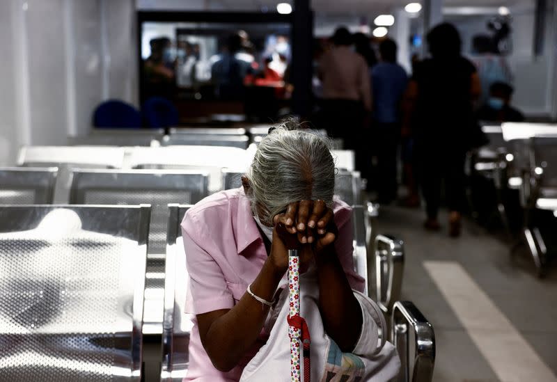 FILE PHOTO: Sri Lankans gather outside the Immigration and Emigration Department to get their passports to leave the country amid the country's economic crisis