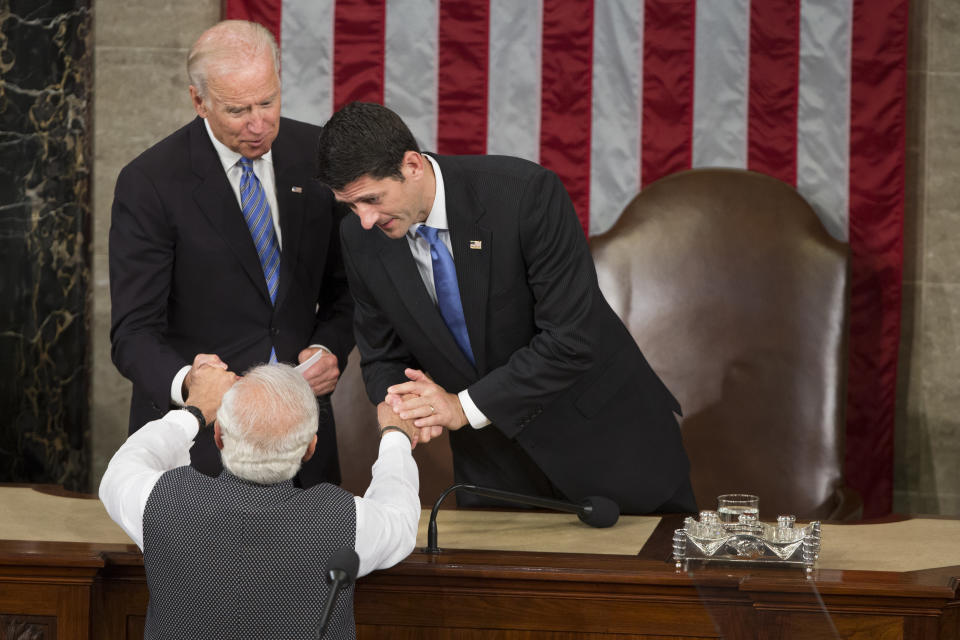 FILE - In this June 8, 2016, file photo, then U.S. Vice President Joe Biden and House Speaker Paul Ryan of Wis., right, shake hands with Indian Prime Minister Narendra Modi during his address to a joint meeting of Congress on Capitol Hill in Washington. India has high hopes its ties with the United States will deepen under President Joe Biden, who was a key proponent of the 2008 civil nuclear deal between the countries and whose new administration includes several Indian Americans. (AP Photo/Evan Vucci, File)