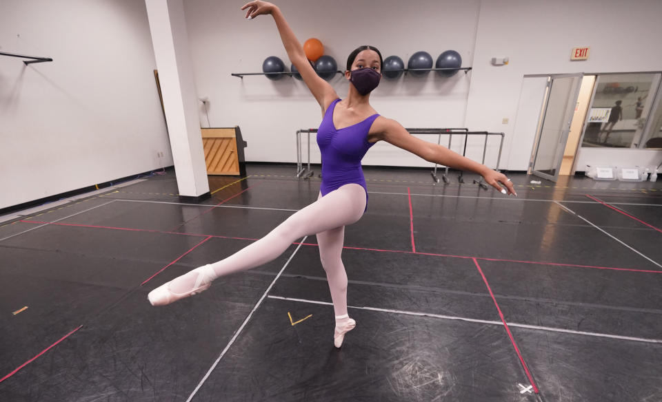 Ballet student Micah Sparrow dances in a classroom at the Texas Ballet Theatre, Wednesday, Oct. 7, 2020, in Fort Worth, Texas. For many, it's not Christmas without the dance of Clara, Uncle Drosselmeyer, the Sugar Plum Fairy, the Mouse King and, of course, the Nutcracker Prince. But this year the coronavirus pandemic has canceled performances of “The Nutcracker” around the U.S. and Canada, eliminating a major and reliable source of revenue for dance companies already reeling financially following the essential shutdown of their industry. (AP Photo/LM Otero)