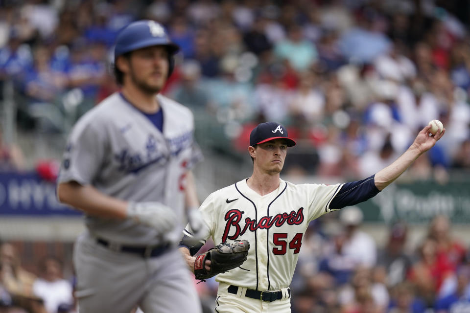 Atlanta Braves starting pitcher Max Fried (54) throws Los Angeles Dodgers starting pitcher Trevor Bauer (27) out at first base after a ground ball in the third inning of a baseball game Sunday, June 6, 2021, in Atlanta. (AP Photo/Brynn Anderson)