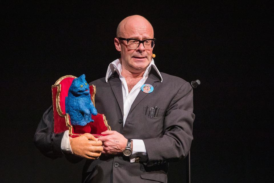 Comedian Harry Hill on stage