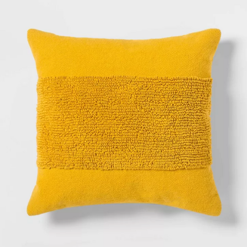 bright yellow modern tufted square throw pillow against white background